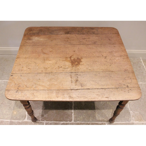 761 - A 19th century oak kitchen table, possibly French, the rectangular plank top with rounded corners ra... 