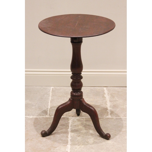 764 - A Victorian mahogany adjustable tripod table, the circular top raised upon a baluster turned column ... 