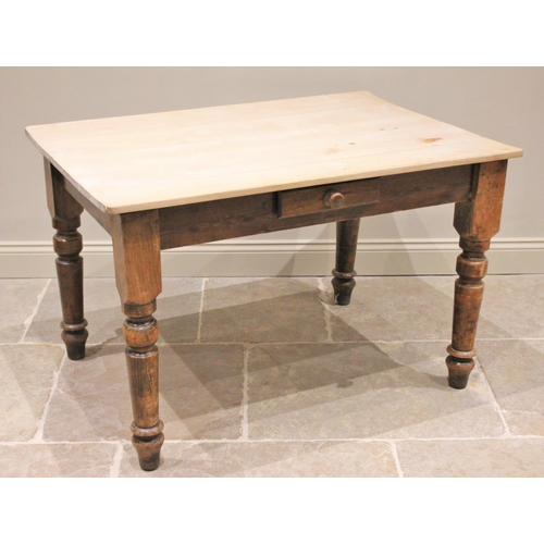 766 - A 19th century pine country kitchen table, the rectangular scrub top with rounded corners above a si... 