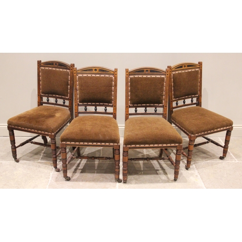 767 - A set of four Victorian oak dining chairs, stamped H Wilson, Manchester, each chair with applied ebo... 