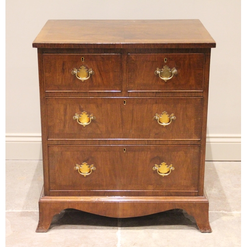 771 - An early 20th century walnut chest of drawers, the burr walnut book veneered and cross banded top, a... 