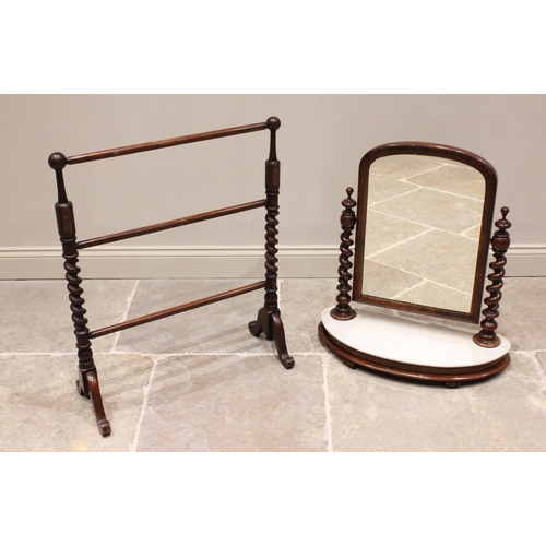 784 - A Victorian mahogany and marble top toilet mirror, the arched mirrored plate within a moulded frame ... 