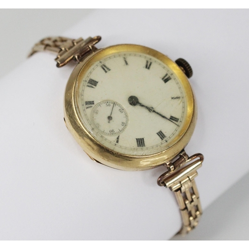 79 - An Edwardian 18ct gold fob watch, the round dial with Roman numerals and subsidiary dial to six 'o' ... 