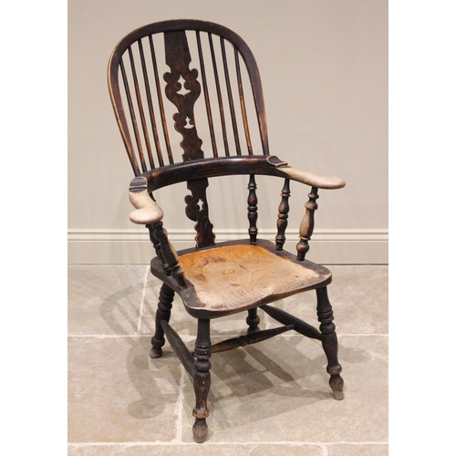 791 - A 19th century elm, ash and alder Windsor farmhouse elbow chair, the hoop back with central pierced ... 