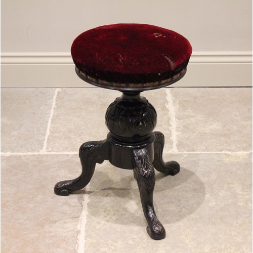 793 - A Victorian carved and stained hardwood adjustable piano stool, the revolving red velour circular se... 