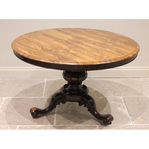 795 - A mid 19th century rosewood centre table, the moulded circular top raised upon a carved bulbous pede... 