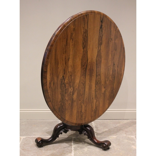 795 - A mid 19th century rosewood centre table, the moulded circular top raised upon a carved bulbous pede... 