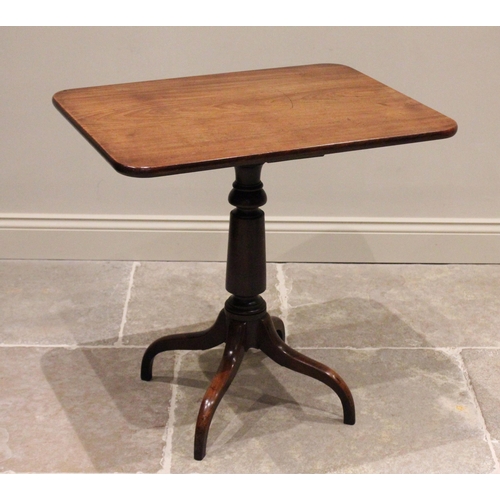 799 - A 19th century mahogany tripod table, the rectangular top with rounded corners raised upon a taperin... 