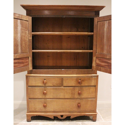 800 - A 19th century and later honey oak Welsh linen press, the cavetto cornice above a plain mahogany fri... 