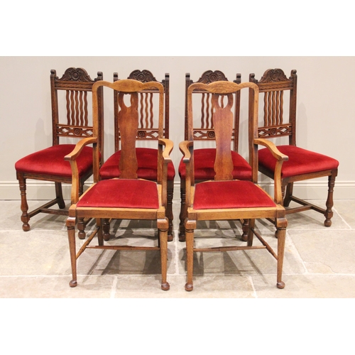 808 - A set of four early 20th century oak dining chairs, each with a carved crest rail above a wavy lath ... 