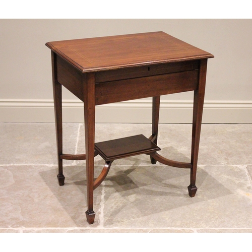 819 - An Edwardian mahogany folding writing table, the rectangular top hinged to reveal a compartmentalise... 