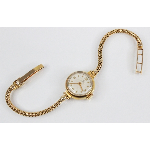 90 - A Ladies Cyma 9ct gold vintage wristwatch, the circular dial with engine turned decoration, Arabic n... 