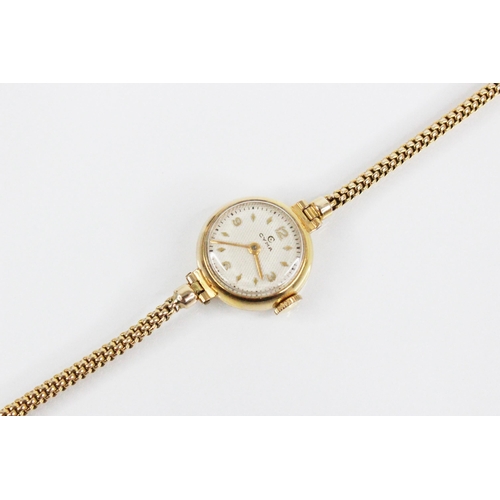 90 - A Ladies Cyma 9ct gold vintage wristwatch, the circular dial with engine turned decoration, Arabic n... 