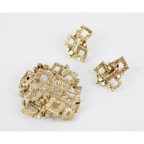 92 - A 1960’s 9ct gold abstract brooch, import marks for London 1969, designed as a cluster of textured s... 