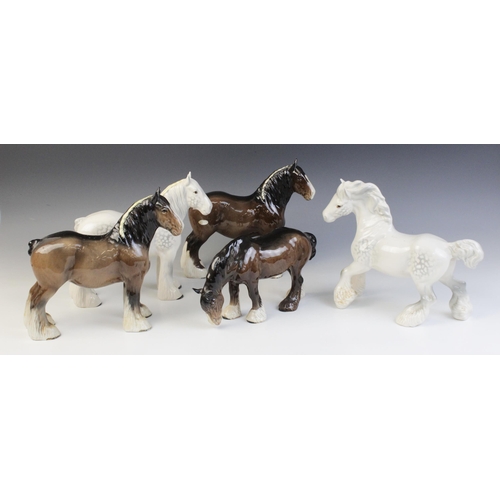 553 - Six Beswick shire horse models, comprising: a Grey Cantering Shire, model No. 975 (discontinued 1989... 