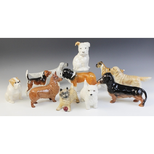 554 - A collection of Beswick dogs, to include a seated bulldog, model No. 1872, 12.2cm high, a boxer dog ... 