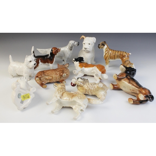 554 - A collection of Beswick dogs, to include a seated bulldog, model No. 1872, 12.2cm high, a boxer dog ... 