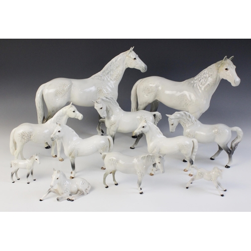 560 - A selection of Beswick Grey horses, to include a Horse, Head Tucked, Leg Up, model No. 1549, first v... 