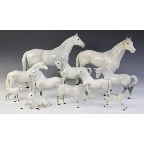 560 - A selection of Beswick Grey horses, to include a Horse, Head Tucked, Leg Up, model No. 1549, first v... 