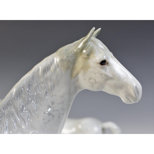 560 - A selection of Beswick Grey horses, to include a Horse, Head Tucked, Leg Up, model No. 1549, first v... 