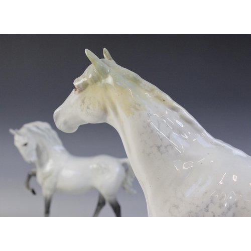 560 - A selection of Beswick Grey horses, to include a Horse, Head Tucked, Leg Up, model No. 1549, first v... 