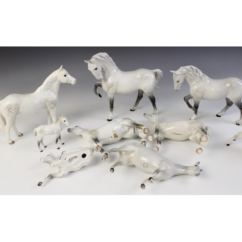 560 - A selection of Beswick Grey horses, to include a Horse, Head Tucked, Leg Up, model No. 1549, first v... 