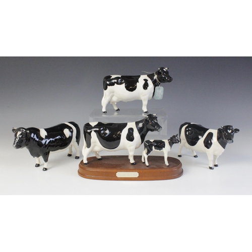 562 - A Beswick Friesian Cow And Calf - On Wooden Plinth, model No. 1362/1249C, issued 1993-1996, 15cm hig... 