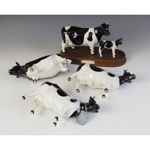 562 - A Beswick Friesian Cow And Calf - On Wooden Plinth, model No. 1362/1249C, issued 1993-1996, 15cm hig... 