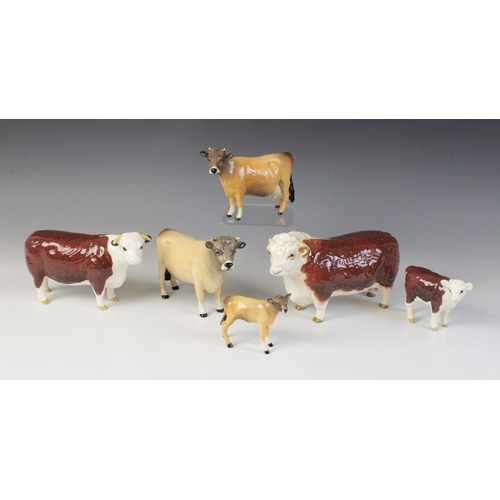 563 - Two Beswick cattle families, comprising: a Jersey Bull, model No. 1422 in gloss, 