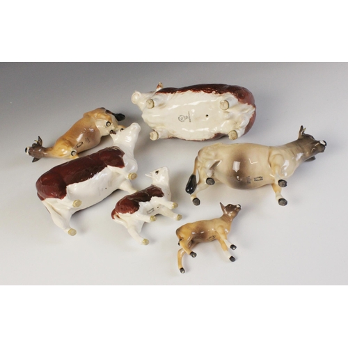 563 - Two Beswick cattle families, comprising: a Jersey Bull, model No. 1422 in gloss, 