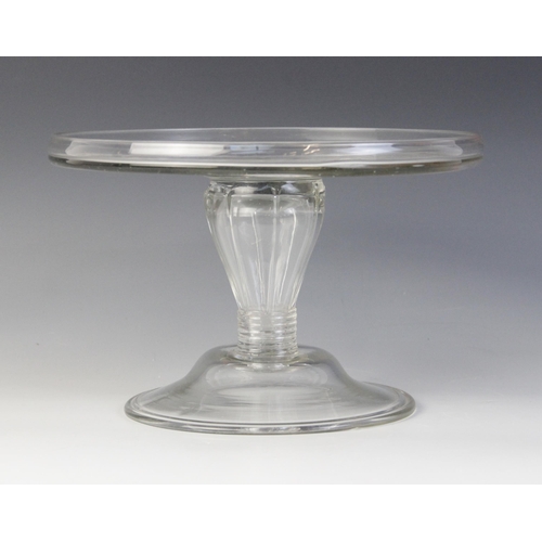 579 - A glass tazza, late 18th century, the flat galleried top raised on a reeded lobed hollow stem of inv... 