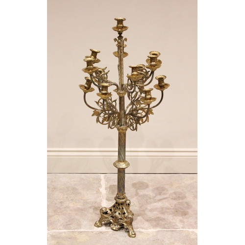 616 - A Louis XVI style gilt metal floor standing candelabra, early 20th century, the tapering central col... 