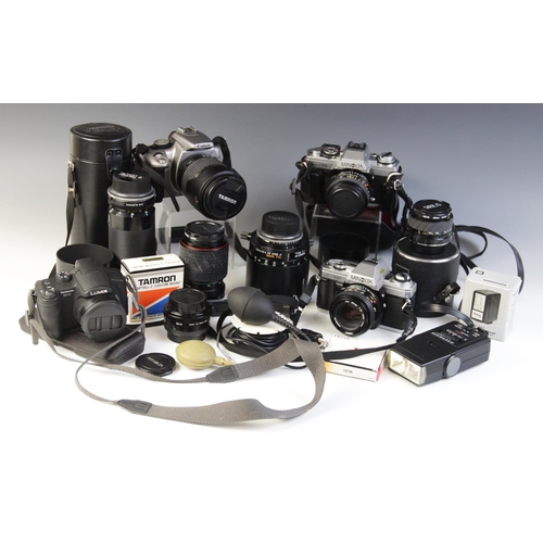 631 - A collection of 35mm camera equipment, comprising: a Minolta XG-M 35mm single lens reflex camera, fi... 