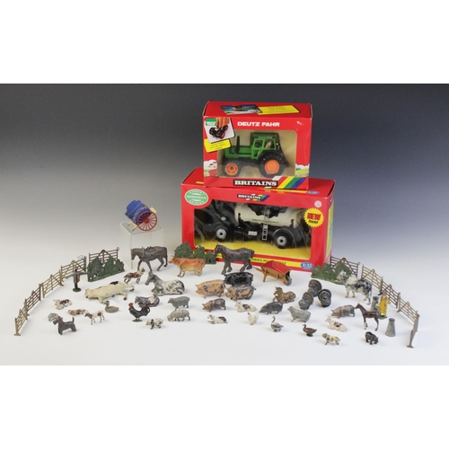 653 - A collection of vintage die-cast farm animals and equipment by Britains and others, to include horse... 