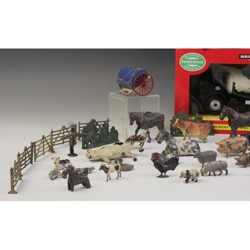 653 - A collection of vintage die-cast farm animals and equipment by Britains and others, to include horse... 