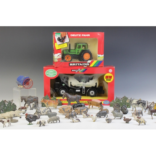 653 - A collection of vintage die-cast farm animals and equipment by Britains and others, to include horse... 