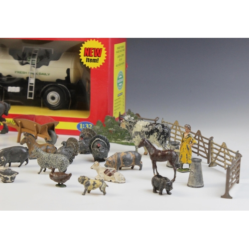 653 - A collection of vintage die-cast farm animals and equipment by Britains and others, to include horse... 