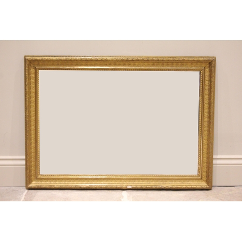 676 - A late 19th century rectangular giltwood and gesso wall mirror, the frame moulded in relief with tra... 