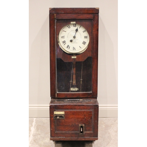 683 - An early 20th century oak cased 'Gledhill-Brook Time Recorders Ltd' clocking on clock, the 25cm pain... 