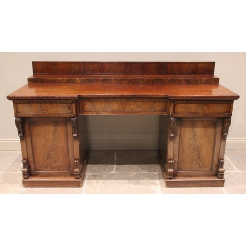 759 - A mid 19th century twin pedestal mahogany chiffonier/sideboard, the stepped galleried back upon an i... 