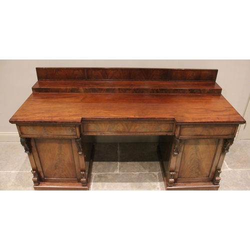 759 - A mid 19th century twin pedestal mahogany chiffonier/sideboard, the stepped galleried back upon an i... 