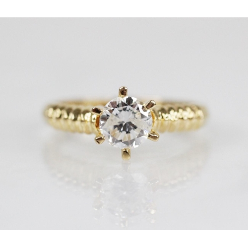 98 - A diamond solitaire ring, the central round brilliant cut diamond weighing approximately 0.70 carats... 