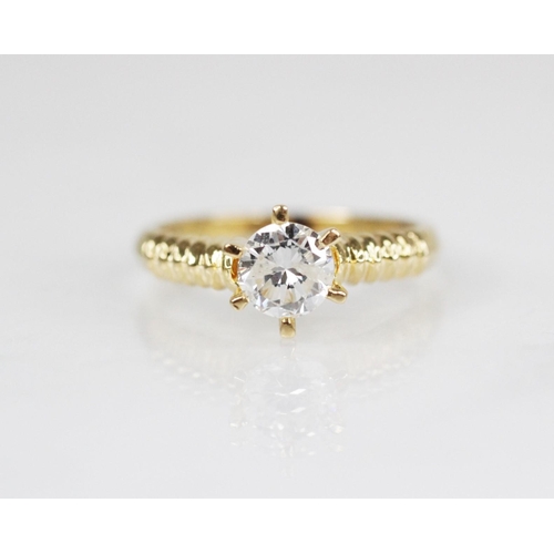 98 - A diamond solitaire ring, the central round brilliant cut diamond weighing approximately 0.70 carats... 