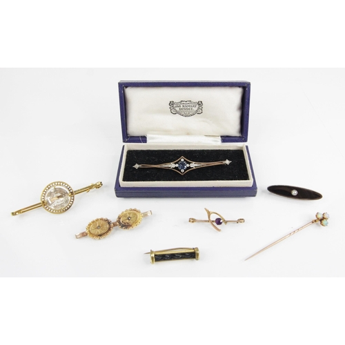 107 - A selection of Victorian and later brooches and stick pins, to include an early 20th century diamond... 