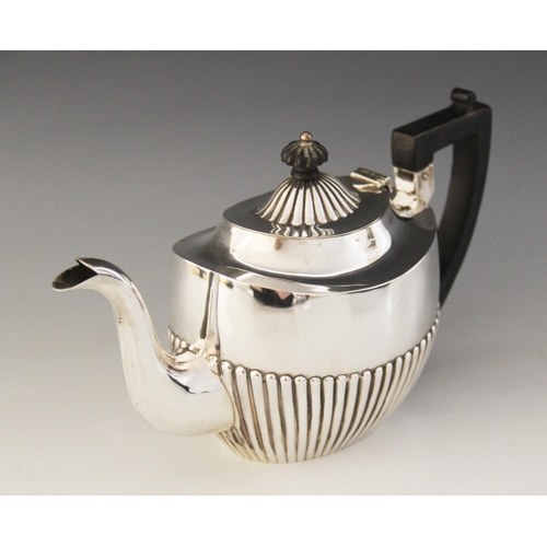 2 - A late Victorian silver teapot, George Nathan & Ridley Hayes, Chester 1899, of oval form with half-f... 
