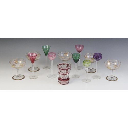 586 - A cut glass beaker, the body with flashed cranberry bands, the top band wheel cut with a continuous ... 