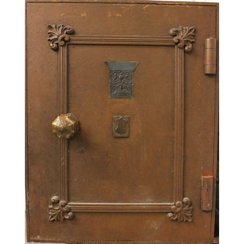 637 - A late 19th century cast iron floor standing safe, with cast shell decoration and label for ‘Millner... 