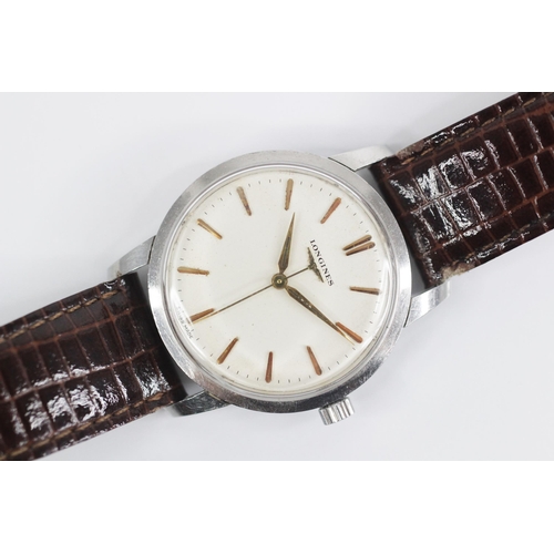 76 - A gentleman's Longines automatic wristwatch, round cream dial with gold coloured baton markers, set ... 