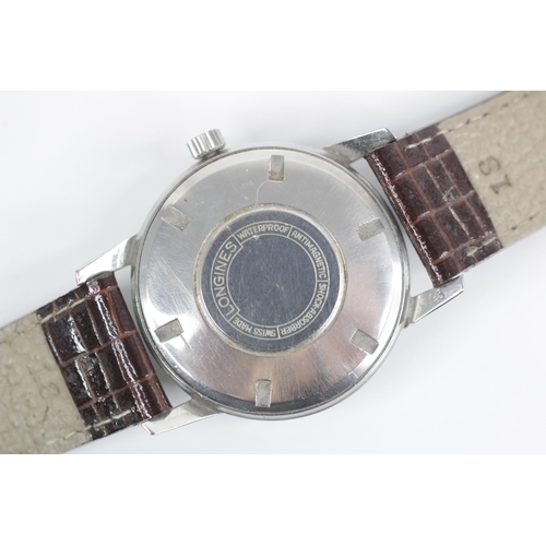 76 - A gentleman's Longines automatic wristwatch, round cream dial with gold coloured baton markers, set ... 