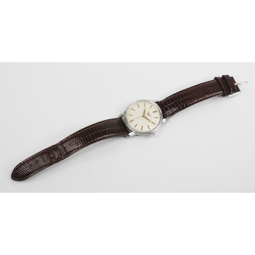 76 - A gentleman's Longines automatic wristwatch, round cream dial with gold coloured baton markers, set ... 